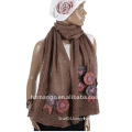Mesh design knitted scarf with knitted flower decoration